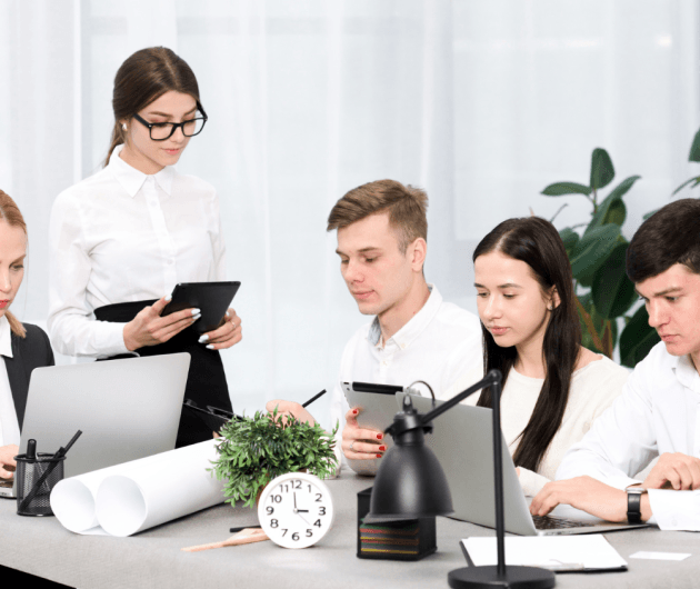 A group of Clinical Counsellors sitting at a table.