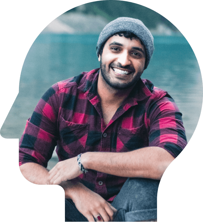 A smiling man with an eccentric head shape symbolizing mental health awareness.