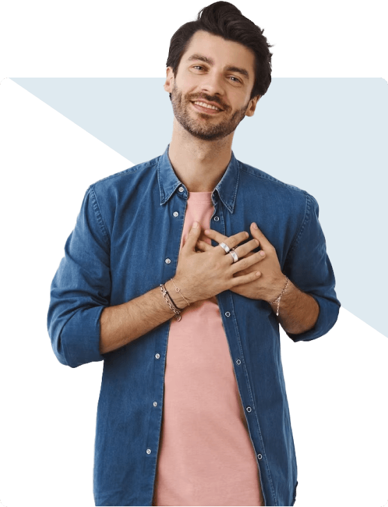 A man in a blue shirt showcasing signs of mental health distress with his hands on his chest.