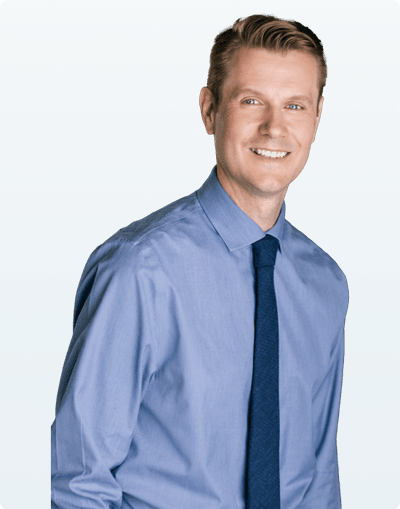 A Surrey counselor in a blue shirt and tie.
