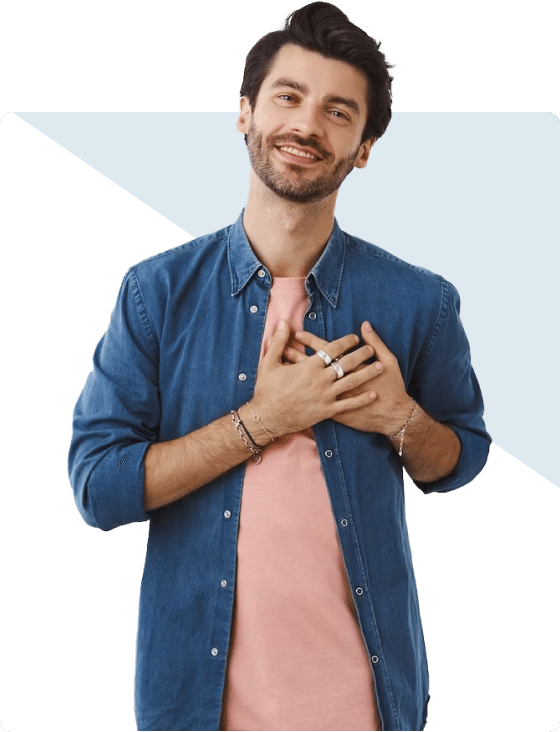 A man in a blue shirt showcasing signs of mental health distress with his hands on his chest.