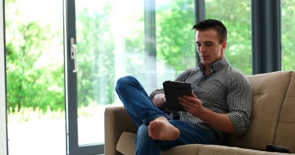 A man using a tablet computer for mental health.